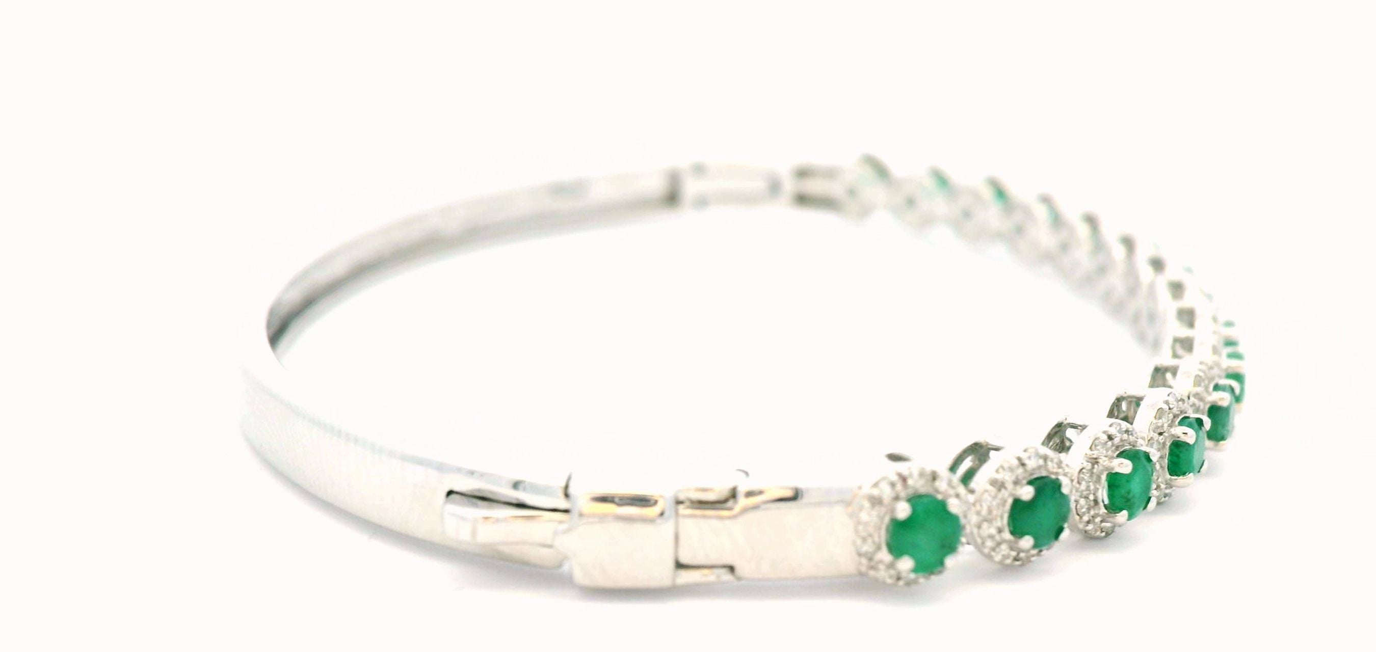 BRACELET 14KW 0.45CTW DIAMOND & EMERALD OVAL BANGLE- 1.60CT EMERALD - W/ DIAM HALO